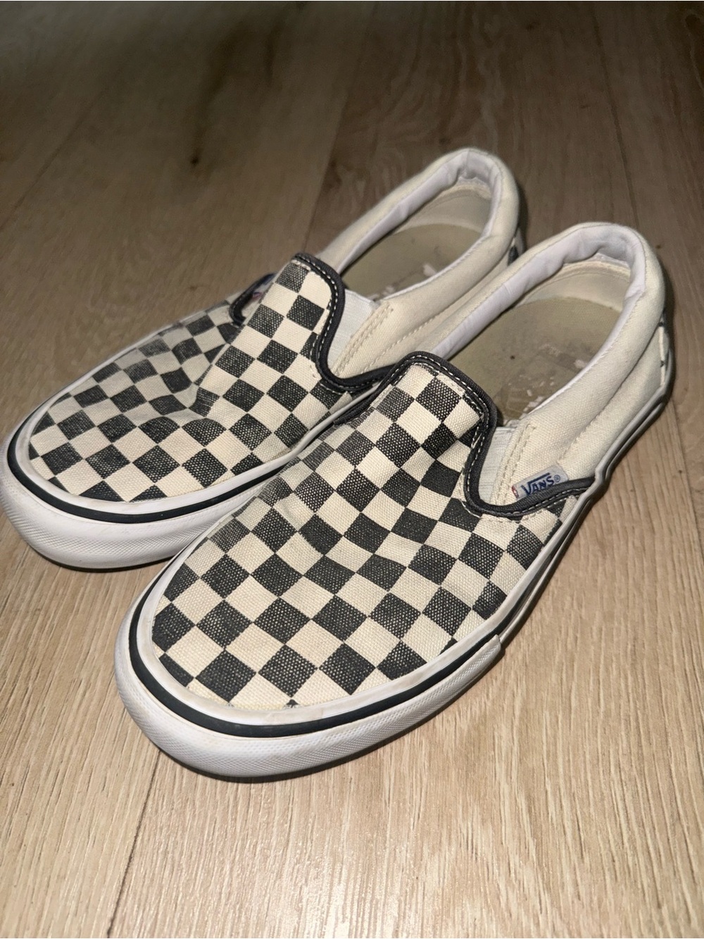 Vans men’s Checkerboard Slip-On Sneakers - Black & White